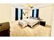 Spacious bedroom with plush carpet, ceiling fan, and natural light at 45 Oak St, Great Falls, SC 29055