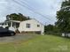 Exterior view of house with siding and partially fenced yard at 45 Oak St, Great Falls, SC 29055
