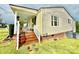Spacious front porch with rocking chairs, offering an inviting spot for relaxation and enjoying the outdoors at 45 Oak St, Great Falls, SC 29055