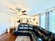 Comfortable living room area featuring hardwood floors, ceiling fan, and a view into the open kitchen at 45 Oak St, Great Falls, SC 29055