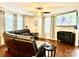 Living room area with hardwood floors, a ceiling fan, and a large screen television at 45 Oak St, Great Falls, SC 29055