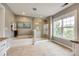 Bright bathroom features a soaking tub, glass shower, and tile flooring at 4711 Pearmain Dr, Waxhaw, NC 28173