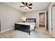 Cozy bedroom with carpet, a ceiling fan, and neutral walls creates a comfortable and inviting space at 4711 Pearmain Dr, Waxhaw, NC 28173