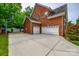 A spacious three-car garage and expansive driveway offer ample parking and functionality to the home at 4711 Pearmain Dr, Waxhaw, NC 28173