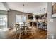A stylish kitchen and breakfast nook bathed in natural light offering stainless appliances and granite counters at 4711 Pearmain Dr, Waxhaw, NC 28173