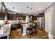 Well-equipped kitchen featuring granite countertops, stainless steel appliances, and dark wood cabinets at 4711 Pearmain Dr, Waxhaw, NC 28173