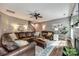 Inviting living room with a large leather sectional, fireplace, and neutral decor at 4711 Pearmain Dr, Waxhaw, NC 28173
