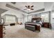 Spacious main bedroom with tray ceiling, large windows, and sitting area at 4711 Pearmain Dr, Waxhaw, NC 28173