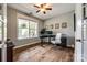 Bright home office with hardwood floors, neutral paint, and large window for ample natural light at 4711 Pearmain Dr, Waxhaw, NC 28173