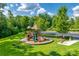 Community playground with slides, climbing features, seating, and landscaping at 4711 Pearmain Dr, Waxhaw, NC 28173