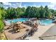 Aerial view of the community pool with playground, splash pad and multiple seating areas at 4711 Pearmain Dr, Waxhaw, NC 28173