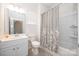 Clean bathroom with a vanity, toilet, and tub-shower combo, featuring elegant neutral decor at 529 Cellini Pl # 243, Mount Holly, NC 28120