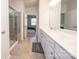 Well-lit bathroom featuring a large vanity, tile flooring, and glass enclosed shower at 529 Cellini Pl # 243, Mount Holly, NC 28120