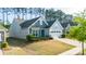 Charming single-Gathering home featuring a two-car garage, manicured lawn, and architectural shingle roof at 529 Cellini Pl # 243, Mount Holly, NC 28120