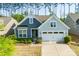 Beautiful home showcasing a two-car garage, nicely landscaped front yard, and durable siding at 529 Cellini Pl # 243, Mount Holly, NC 28120