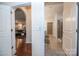 Hallway leading to the main bedroom and bathroom with tile flooring at 529 Cellini Pl # 243, Mount Holly, NC 28120