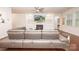 Cozy living room featuring a modern fireplace, built-in shelving, hardwood floors, and a comfortable sofa at 529 Cellini Pl # 243, Mount Holly, NC 28120