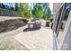 Outdoor stone grill area with built in stainless steel grill, and a brick-paved patio at 529 Cellini Pl # 243, Mount Holly, NC 28120