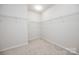 Empty walk-in closet with neutral carpeting and wire shelving for organized storage solutions at 529 Cellini Pl # 243, Mount Holly, NC 28120