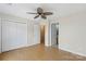 Bright bedroom with hardwood floors, ceiling fan, and access to an ensuite bathroom at 534 Donatello Ave, Charlotte, NC 28205