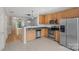 Well-equipped kitchen featuring stainless steel appliances, wood cabinets, and an open layout at 534 Donatello Ave, Charlotte, NC 28205