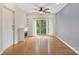 Spacious living room with hardwood floors, recessed lighting, ceiling fan, and balcony access at 534 Donatello Ave, Charlotte, NC 28205