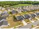 Stunning aerial view of the home, showcasing its location in a desirable neighborhood with green spaces at 550 Cherry Blossom Nw Ave, Concord, NC 28027