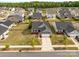 Beautiful aerial view of the home showcasing its well-manicured lawn, landscaping, and neighborhood at 550 Cherry Blossom Nw Ave, Concord, NC 28027