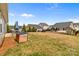 Expansive backyard featuring a patio with seating, providing ample space for recreation and relaxation at 550 Cherry Blossom Nw Ave, Concord, NC 28027