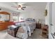 Spacious primary bedroom featuring a ceiling fan, carpet floors, and bright natural light at 550 Cherry Blossom Nw Ave, Concord, NC 28027