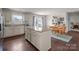 Eat-in kitchen featuring an island, granite countertops, stainless steel appliances, and backyard access at 550 Cherry Blossom Nw Ave, Concord, NC 28027
