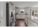 Bright eat-in kitchen featuring stainless steel appliances, granite countertops, and a sliding glass door at 550 Cherry Blossom Nw Ave, Concord, NC 28027