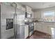 Modern kitchen with stainless steel appliances, granite countertops, and white cabinetry at 550 Cherry Blossom Nw Ave, Concord, NC 28027