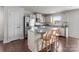 Well-lit kitchen showcasing stainless steel appliances, and an island with seating at 550 Cherry Blossom Nw Ave, Concord, NC 28027