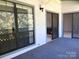 Carpeted outdoor balcony with sliding glass doors leading into the home at 5810 Harris Grove Ln, Charlotte, NC 28212