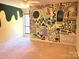 A bedroom with whimsical wall art, carpet, and ceiling fan at 5810 Harris Grove Ln, Charlotte, NC 28212