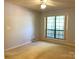 Bedroom features neutral walls, carpet, and ceiling fan at 5810 Harris Grove Ln, Charlotte, NC 28212