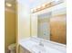 Bathroom view showcasing a sink with a neutral countertop, a toilet, and a large mirror with lighting at 5944 Freedom Dr, Charlotte, NC 28214