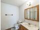 This is a bathroom with a sink, mirror, toilet, and a shower reflected in the mirror at 5944 Freedom Dr, Charlotte, NC 28214