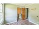 Cozy bedroom with two doorways, and wood-look flooring, bathed in natural light for a warm and inviting feel at 5944 Freedom Dr, Charlotte, NC 28214