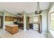 Open concept eat-in kitchen with view to a butler's pantry with two ovens and a countertop at 5944 Freedom Dr, Charlotte, NC 28214