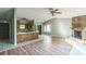 Open concept space featuring the kitchen, living, and dining areas with neutral wall color, fireplace, and hardwood floors at 5944 Freedom Dr, Charlotte, NC 28214