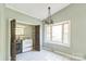View of a butler's pantry featuring appliances, a window, and neutral paint at 5944 Freedom Dr, Charlotte, NC 28214