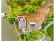 Aerial view of property, showcasing meticulously landscaped grounds, private driveway, and water access at 6788 Bucleigh Rd, Clover, SC 29710