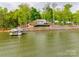 Stunning waterfront home with private dock and lush landscaping on a picturesque lake setting at 6788 Bucleigh Rd, Clover, SC 29710