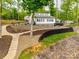 Charming lakefront home with a modern design, terraced landscaping, and a stone walkway at 6788 Bucleigh Rd, Clover, SC 29710