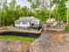 Lakefront home featuring modern architecture, a deck, and professional landscaping at 6788 Bucleigh Rd, Clover, SC 29710