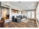 Spacious living room with a sectional sofa and an open view into the kitchen and dining areas at 6788 Bucleigh Rd, Clover, SC 29710