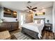 Serene main bedroom with a large bed, stylish furniture, and access to an ensuite bathroom at 6788 Bucleigh Rd, Clover, SC 29710
