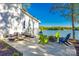 Spacious outdoor patio with lounge seating, a fire pit, and breathtaking lake views at 6788 Bucleigh Rd, Clover, SC 29710